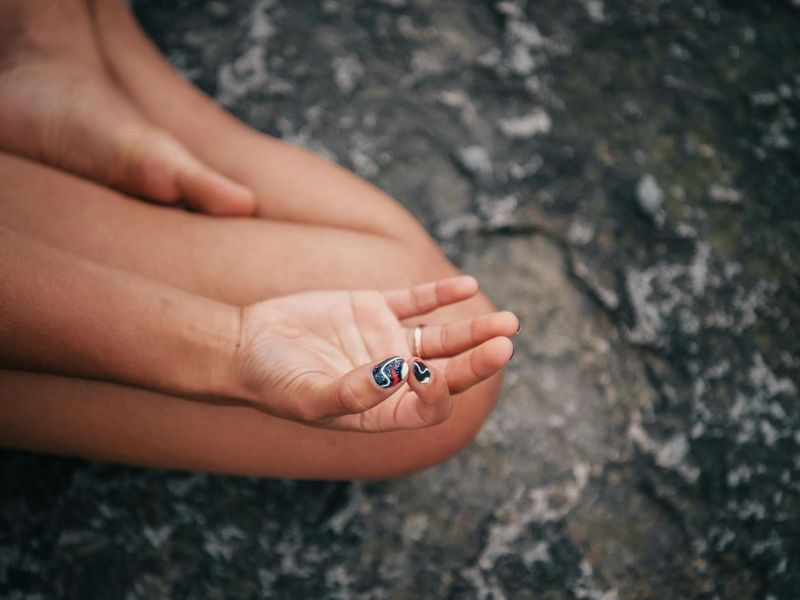 Detailed close-up of hands in a mudra position